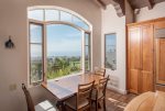 Ocean view breakfast table located in the kitchen with amazing golf course views